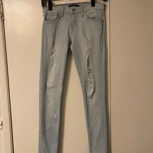 Light washed jeans. Stylish rips. Not high waisted.